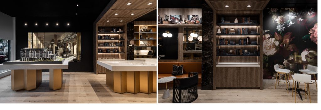 Modern interior with wood floors, gold-accented tables, open shelving, books, floral wall mural, and stylish lighting, blending contemporary and classic decor elements—a look befitting spaces recognized by the National Awards for Housing Excellence.