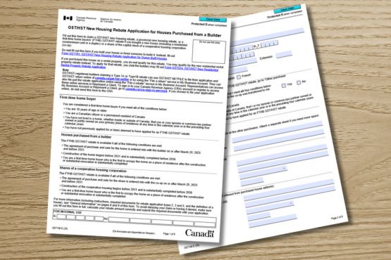 Canadian government form titled GST191-WS New Housing Rebate Application for Houses Purchased from a Builder are placed on a wooden surface, with text fields and sections visible on both pages.