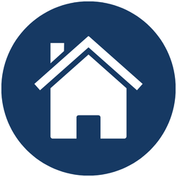 A white house icon with a chimney inside a dark blue circle, representing a home or homepage symbol.